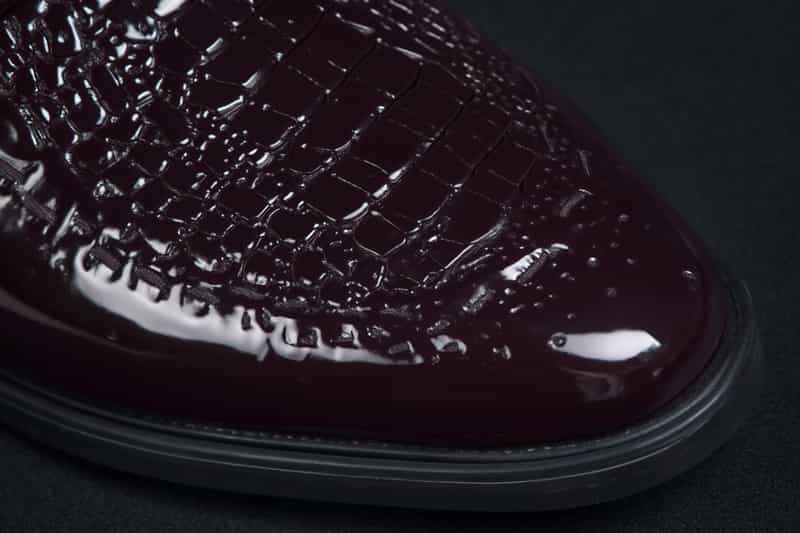dcm-styles-dark-purple-shoes-from-the-front-with-a-blur-background